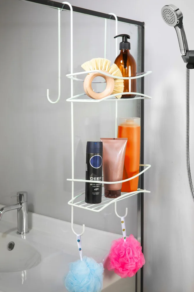 Compact shower organizer with toiletries and loofahs, perfect for space-saving in modern bathrooms.